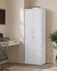A white metal storage cabinet with two doors, a lock, and adjustable shelves, placed in an office setting next to a desk and chair. Náhled obrázku produktu