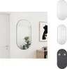 A mirror is shown hanging on a white wall next to a framed picture and a wooden cabinet. Náhľad obrázku produktu