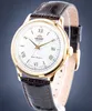 A close-up shot of a men's wristwatch with a white dial, gold casing, and a brown leather strap. Produktbild-Vorschau