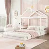 A child's bedroom with a white house-shaped bed, pink curtains, and a paw-shaped chair. Produktbild-Vorschau