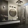 A modern bathroom with a vanity, sink, mirror, and shower. Podgląd zdjęcia produktu