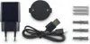 A collection of electronic accessories, including a power adapter, a USB cable, a circular device, screws, and wall plugs, laid out on a white background. Produktbild-Vorschau