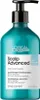 A teal bottle of L'Oréal Professionnel shampoo with a black pump dispenser. Produktbild-Vorschau