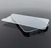 A clear screen protector is placed on top of a black smartphone. Voir les images du produit
