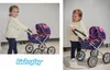 A young child plays with a doll stroller in two different shots. Produktbild-Vorschau
