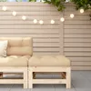A close-up view of a modular outdoor sofa element with beige cushions, set against a light-colored wooden slatted wall and a tiled patio. String lights are visible overhead. Náhled obrázku produktu