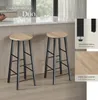 Two bar stools are shown in a kitchen setting, with close-up details of the stool legs and seat material. Náhled obrázku produktu