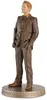 A figurine of a man in a suit standing on a decorative base. Produktbild-Vorschau