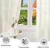 A close-up view of a cream-colored curtain hanging in a window, with a vase of tulips and a mug on a small table in the foreground. Three circular icons with text labels are at the bottom of the image. Produktbild-Vorschau