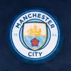 A close-up of the Manchester City FC crest. Produktbild-Vorschau
