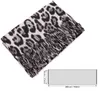 A leopard print scarf is shown diagonally on a white background, with a size diagram below it. Produktbild-Vorschau