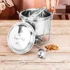 A stainless steel Feuerzangenbowle set is displayed on a wooden table, with decorative elements like dried orange slices and cinnamon sticks. Voir les images du produit
