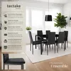 A dining table and chairs set in a modern dining room setting. Náhled obrázku produktu