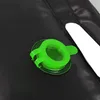 A close-up of a black camping shower bag with a green valve. Náhled obrázku produktu