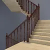 A staircase with a wooden railing and beige steps. Náhľad obrázku produktu