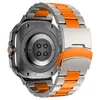 The back of a smartwatch with a metal and orange band. Náhled obrázku produktu