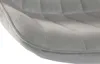 A close-up view of the quilted upholstery of a gray bar stool. Podgląd zdjęcia produktu