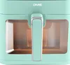 Close-up of a mint green air fryer with a silver handle and two windows. Produktbild-Vorschau