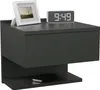 A modern gray nightstand with a drawer and shelf, featuring a framed picture and a digital clock on top. A smartphone is placed on the shelf.