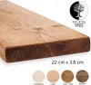 A close-up of a wooden shelf with different color samples shown below. Produktbild-Vorschau