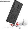 A black phone case is shown falling towards a cracked surface, illustrating its shock protection. Produktbild-Vorschau