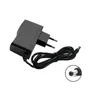A black power adapter with a European plug and a coiled cable with a connector. Produktbild-Vorschau