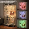 A glass display cabinet filled with various figurines and collectibles, illuminated by colored LED lights. Produktbild-Vorschau