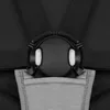 A close-up view of a stroller harness buckle and a pocket. Produktbild-Vorschau