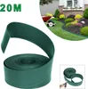 A roll of green plastic lawn edging and a landscaped garden bed. Voir les images du produit