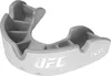 A close-up studio shot of a white and gray UFC branded mouthguard. Produktbild-Vorschau