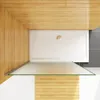 A top-down view of a shower tray with a glass partition, set against a wooden wall. Produktbild-Vorschau