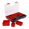 An open sortiment box with multiple compartments, some filled with red bins, and several loose red bins scattered around it. Náhľad obrázku produktu