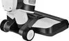 A close-up view of the bottom section of a white and black vacuum cleaner, showing its wheels and cleaning head. Podgląd zdjęcia produktu