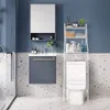 A bathroom scene featuring a vanity, toilet, and shelving unit. Podgląd zdjęcia produktu
