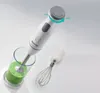 A white Gorenje hand blender is shown in use, blending a green smoothie in a glass. A whisk attachment is also visible. Anteprima dell’immagine prodotto