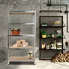 A storage shelf unit with various items displayed on it, next to a wall with industrial-style fixtures. Produktbild-Vorschau