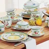 A beautifully set table with Villeroy & Boch French Garden Fleurence dinnerware, featuring fruit and floral motifs. Produktbild-Vorschau