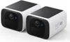 Two white and black security cameras are shown against a white background. Voir les images du produit