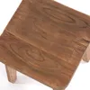 A close-up view of a wooden stool. Náhled obrázku produktu