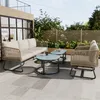 A patio furniture set on a tiled patio with greenery in the background. Náhľad obrázku produktu