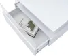 A white coffee table with an open drawer revealing a book. Voir les images du produit