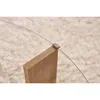 A close-up view of a wooden table leg supporting a glass tabletop, with a metal clip securing the glass to the wood. Produktbild-Vorschau