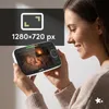 A woman is holding a baby monitor that displays an image of a sleeping baby. There is an overlay with text and graphics. Náhled obrázku produktu