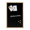 A black chalkboard with a wooden frame, decorated with two small floral pictures and the word "Welcome" written in chalk. Produktbild-Vorschau