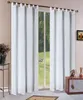 White curtains hanging in front of a window with a view of a garden. Produktbild-Vorschau