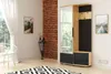 A hallway with a modern furniture unit, a chair, and a rug. Náhled obrázku produktu