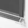 A close-up view of a grey roller blind with a striped pattern and a clear plastic bracket. Produktbild-Vorschau