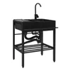 A black double basin kitchen sink with a faucet and plumbing underneath, set against a white background. Produktbild-Vorschau