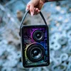 A hand holding a portable speaker with colorful lights. Produktbild-Vorschau