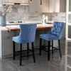 Two blue bar stools in a modern kitchen setting. Produktbild-Vorschau